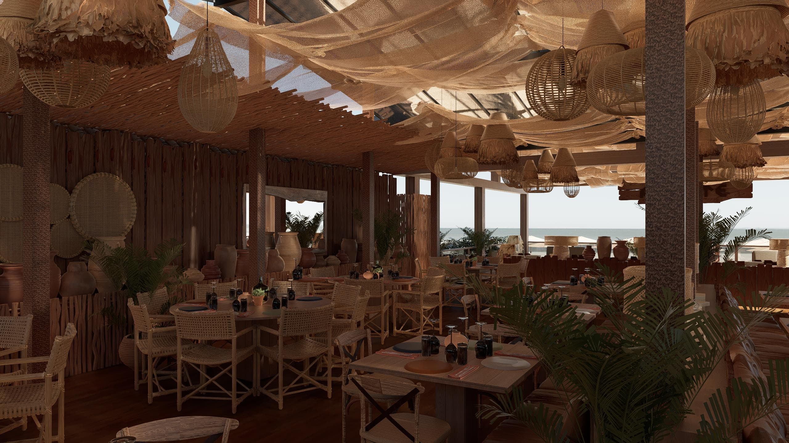 Salão do restaurante do Amaité, com mesas de fibra natural e o mar ao fundo